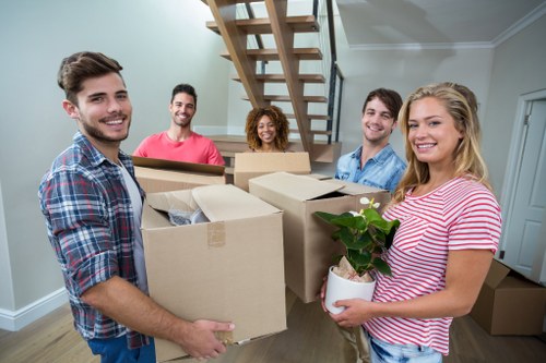 Moving team sorting labelled boxes for a central London property