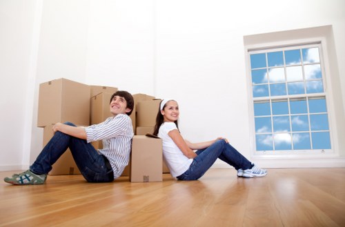 Office furniture and boxes prepared for a business move in central London