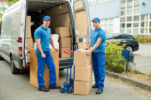 Packed boxes and furniture ready for collection from a central London flat
