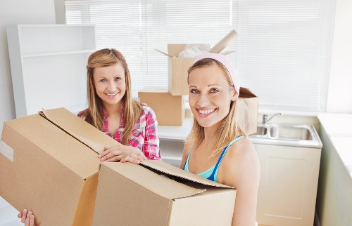 Packed moving boxes and furniture prepared for a Marylebone home relocation