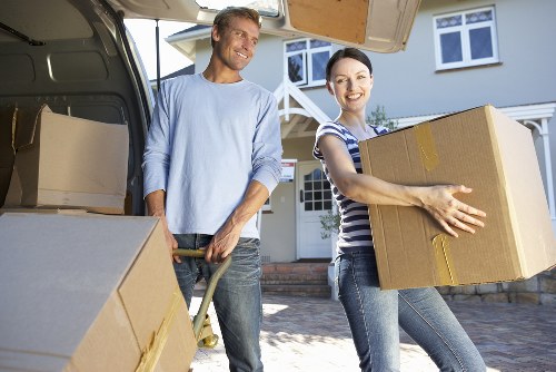 Student move essentials including boxes, suitcase, and study equipment prepared for transport