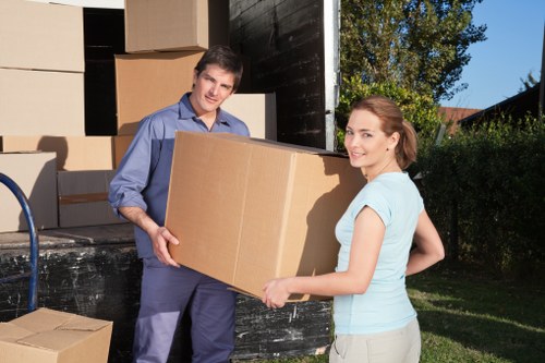 Careful loading of household items for a short notice move in central London
